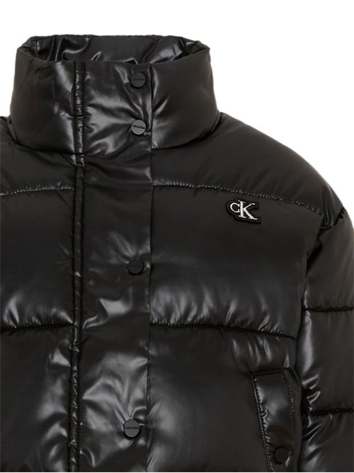 Piumino Calvin Klein Jeans Kids da bambina nero lucido con collo alto Calvin Klein Kids | LVCKTJM01GBEH